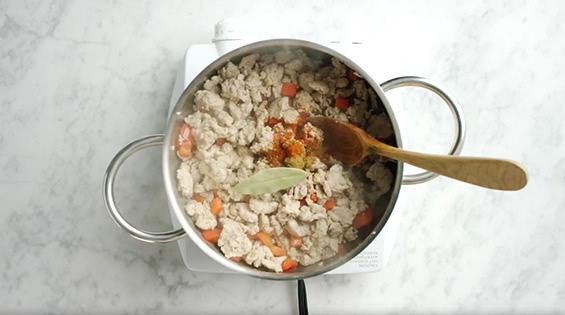 Cooking ingredients mixed in a pot.