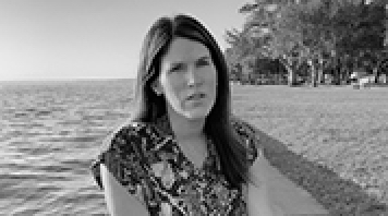 Black and white photo of Jen, who discusses what it's like to live with Crohn's disease.